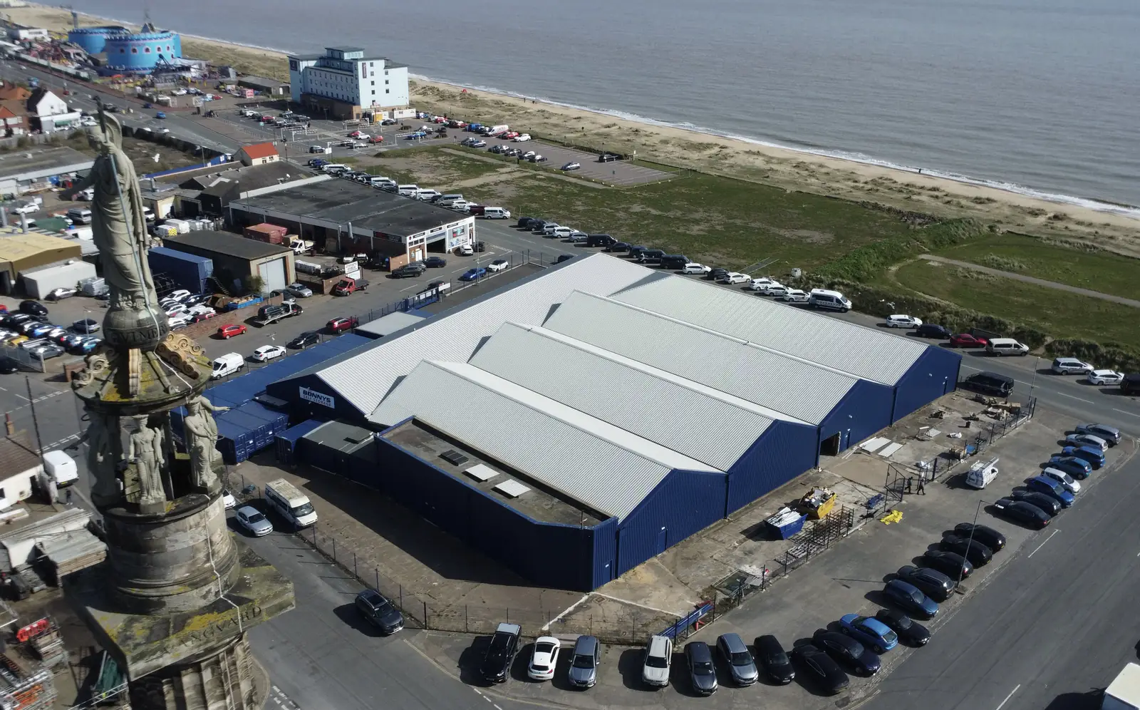 Aerial view of a large seafront commercial unit in Great Yarmouth re-roofed and reclad by Over The Ridge Roofing