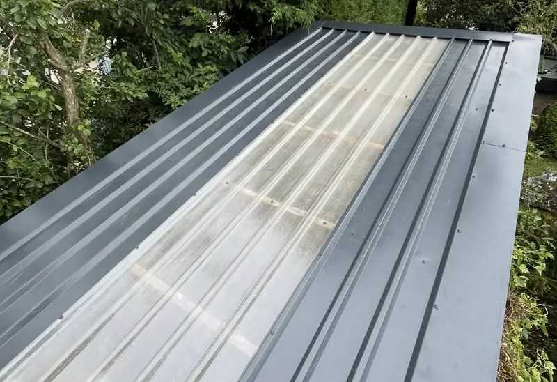 Standing seam metal roof installed on a smaller building by Over The Ridge Roofing
